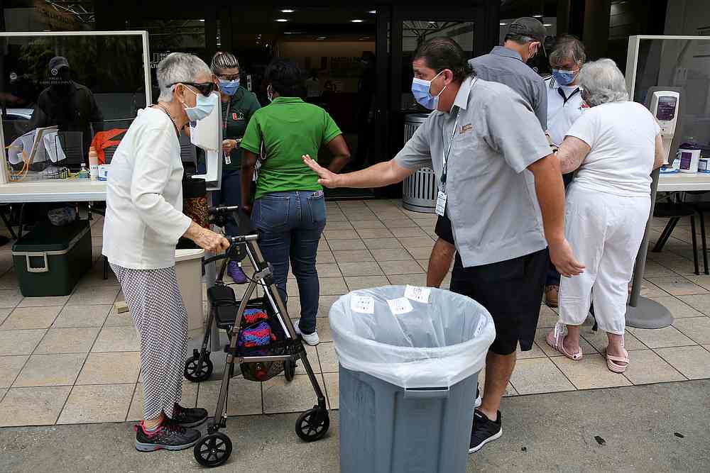 People wait for a health assessment check-in before entering Jackson Memorial Hospital, during the Covid-19 outbreak, in Miami, Florida June 18, 2020. u00e2u20acu201d Reuters pic