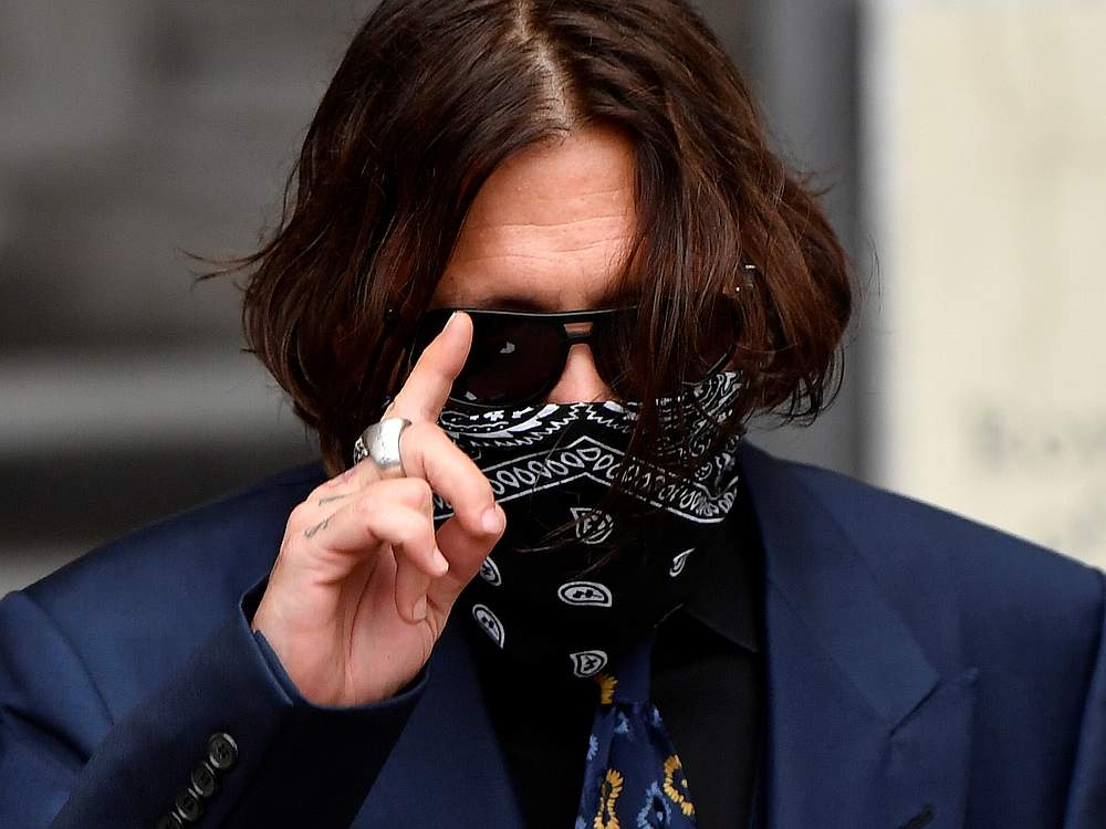 Actor Johnny Depp gestures arrives at the High Court in London July 9, 2020. u00e2u20acu201d Reuters pic