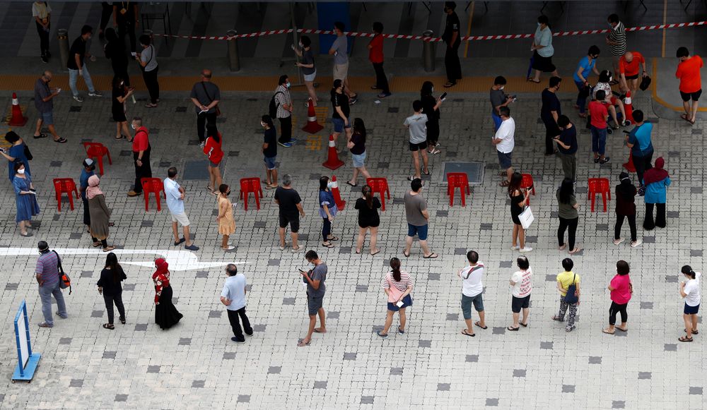 Voters practise social distancing while queuing up at a polling station during Singapore's general election, amid the coronavirus disease (Covid-19) outbreak, in Singapore July 10, 2020. u00e2u20acu201d Reuters pic