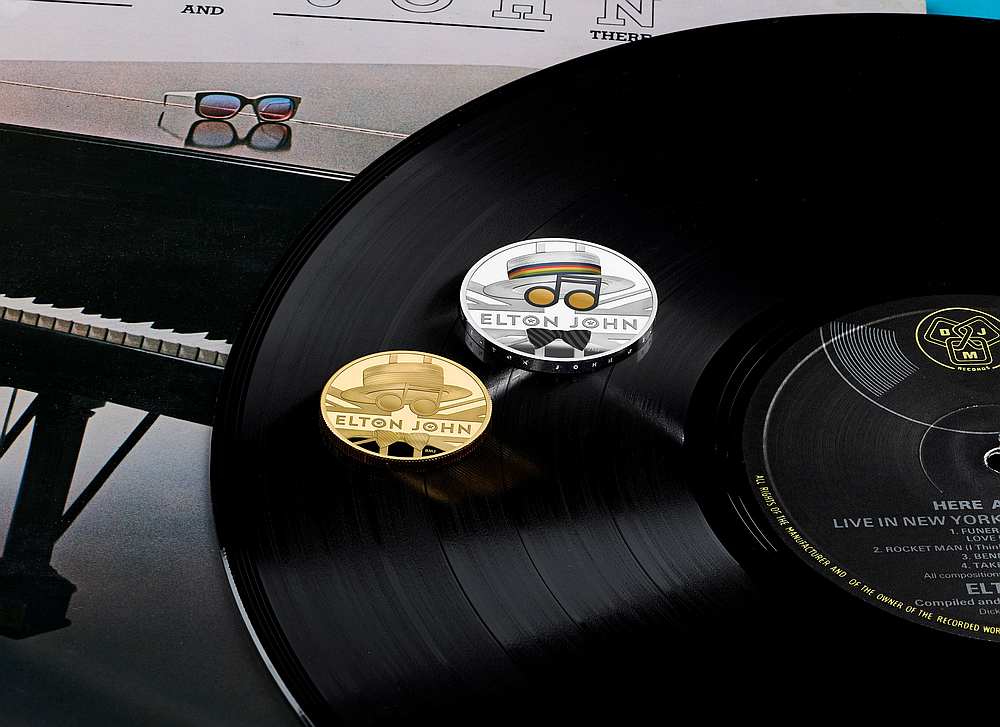 One ounce gold and silver coins from the new competitive Elton John coin collection released by Britain's Royal Mint July 5, 2020. u00e2u20acu201d Royal Mint/Elton John handout via Reuters