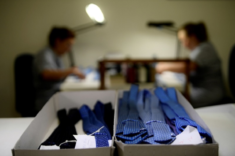Finished bundles of ties sit in boxes as seamstresses work in the workshop of the u00e2u20acu02dcE. Marinellau00e2u20acu2122 shirt and tie makers familybusiness in Naples. u00e2u20acu2022 AFP pic