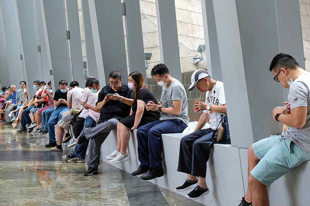 People have lunch at a mall after the government banned dine-in services, following the Covid-19 outbreak in Hong Kong July 30, 2020. u00e2u20acu201d Reuters pic