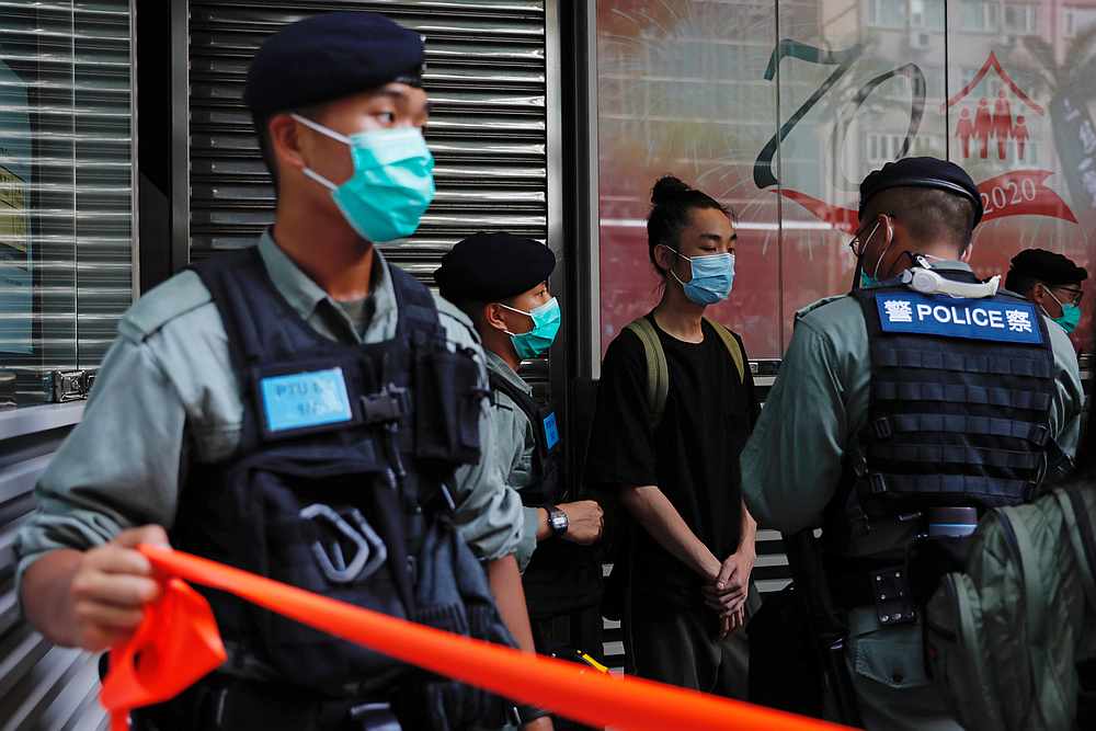 Police search a pro-democracy protester during a demonstration on the anniversary of Hong Kong's handover to China, in Hong Kong July 1, 2020. u00e2u20acu201d Reuters pic