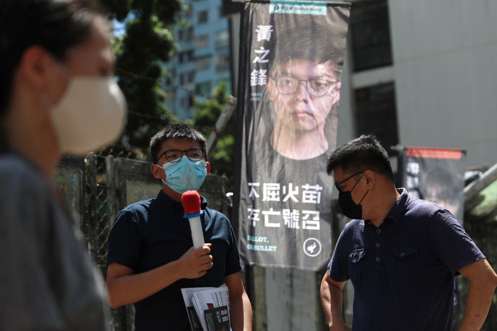 In this file photo taken July 11, 2020, pro-democracy activist Joshua Wong (centre), campaigns during a primary election to select the pro-democracy opposition candidates for election to the cityu00e2u20acu2122s legislative council in Hong Kong. u00e2u20acu201d AFP pic 