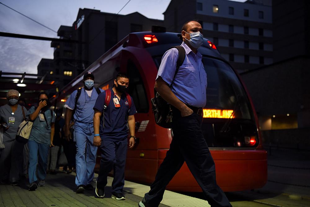 Healthcare workers walk through the Texas Medical Center during a shift change as cases of Covid-19 spike in Houston, Texas July 8, 2020. u00e2u20acu201d Reuters pic