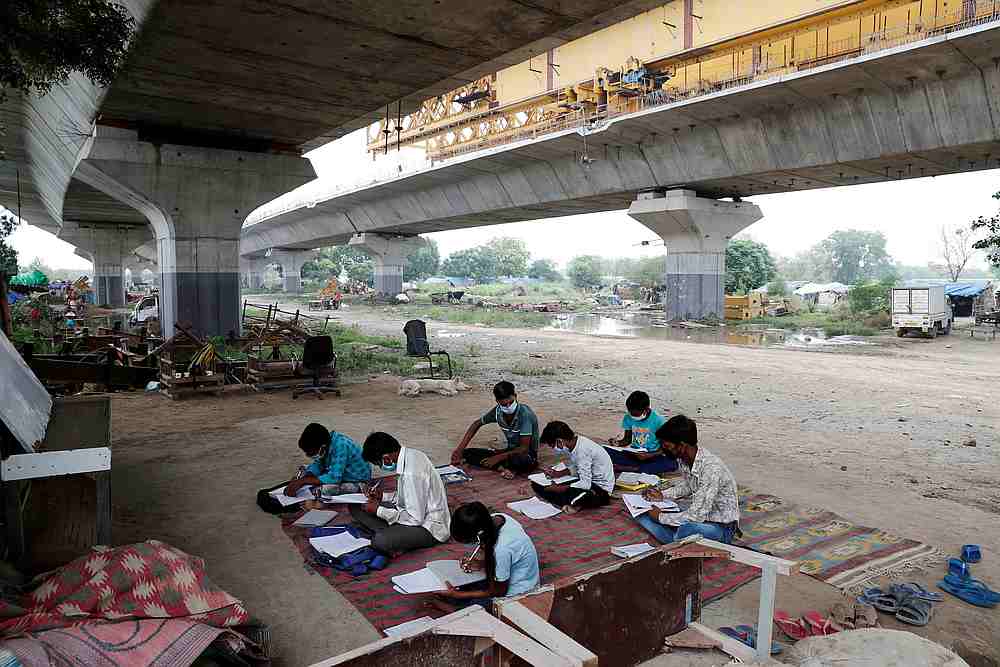 Students from a slum area attend an open-air class after authorities closed all schools in March following the outbreak of Covid-19, in New Delhi, India July 8, 2020. u00e2u20acu201d Reuters pic