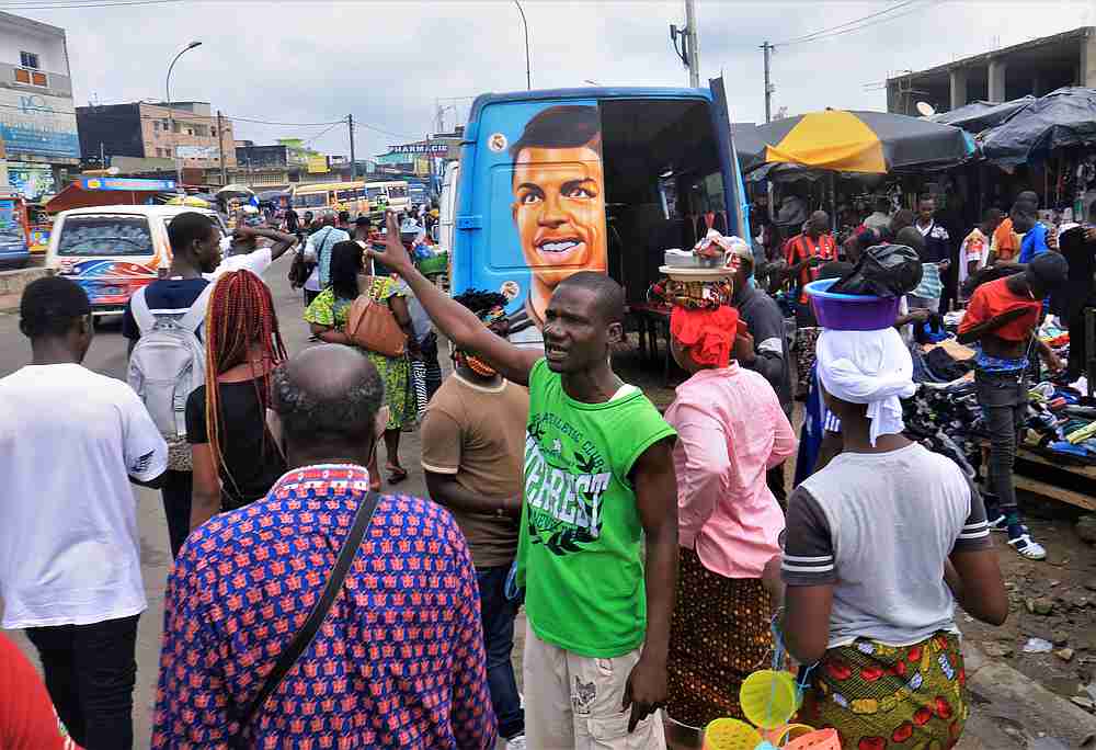 A tout calls for passengers beside his public service van called 'Gbaka,' at a bus station, amid the Covid-19 outbreak in Adjame, Abidjan, Ivory Coast June 24, 2020. u00e2u20acu201d Reuters pic