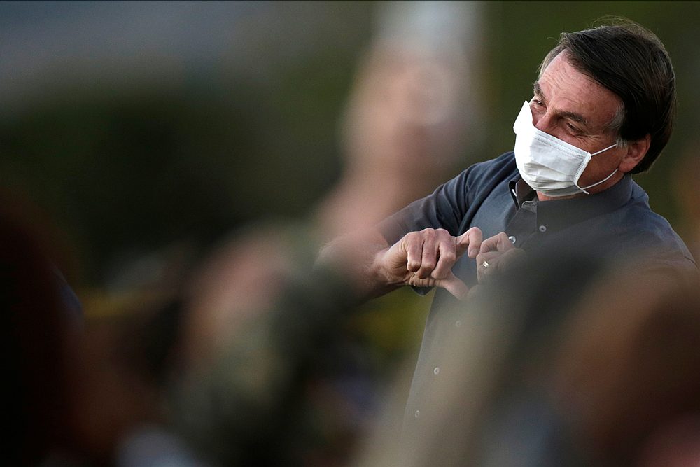 Brazil's President Jair Bolsonaro gestures during a ceremony to lower the Brazilian National flag down, at the Alvorada Palace in Brasilia, Brazil July 20, 2020. u00e2u20acu201d Reuters pic 