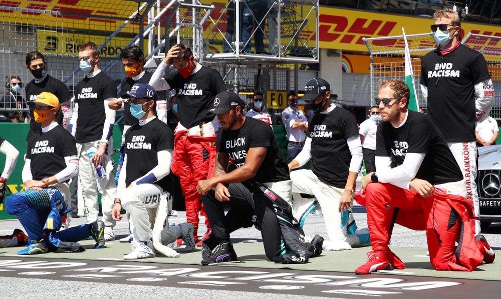 Mercedes' Lewis Hamilton (centre), Ferrari's Sebastian Vettel and the rest of the drivers kneel on the grid wearing an anti-racism T-shirt before the race July 5, 2020. u00e2u20acu201d Reuters pic