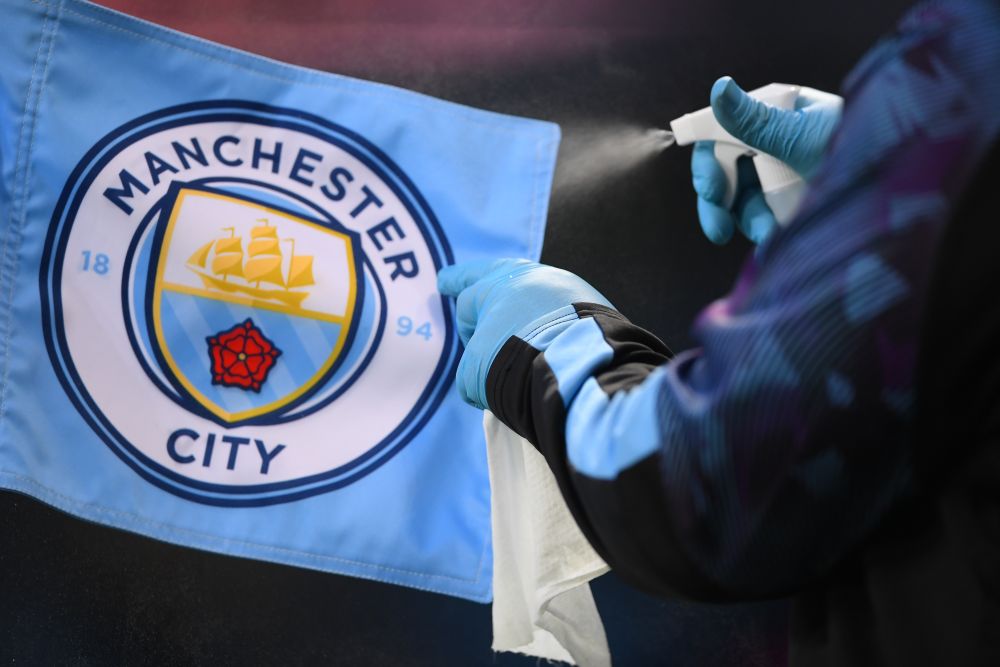 A staff member disinfects the corner flag during Manchester Cityu00e2u20acu2122s Premier League match against Liverpool at the Etihad Stadium, Manchester July 3, 2020. u00e2u20acu201d Reuters picnn