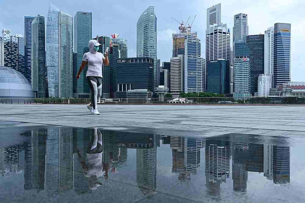 A woman, wearing a face mask as a preventive measure against Covid-19, at Marina Bay in Singapore May 4, 2020. Singaporeans will vote in a general election today (July 10, 2020). u00e2u20acu201d AFP pic