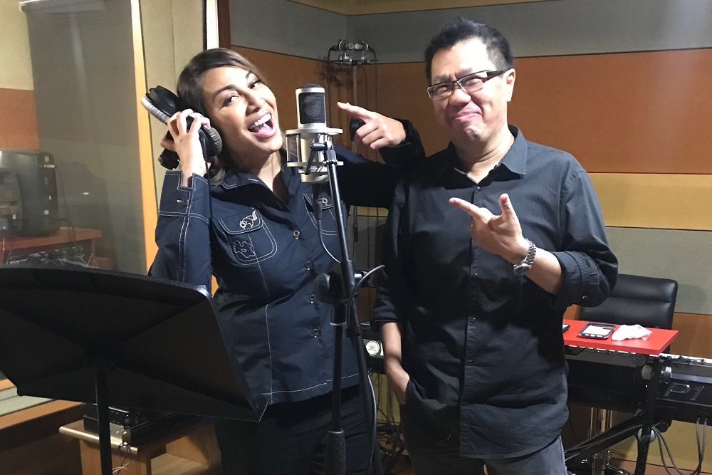 Ning with co-composer Suwito at his studio where ‘Perwira’ was recorded in under four hours. ― Picture courtesy of Primeworks Studio