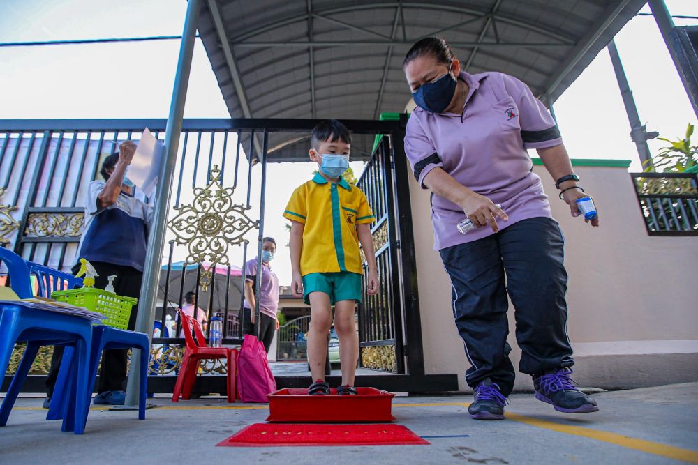 Preschoolers adhere to strict standard operating procedures on the first day of school at Mayter Kindergarten in Cheras on July 1, 2020. u00e2u20acu201d Picture by Hari Anggara