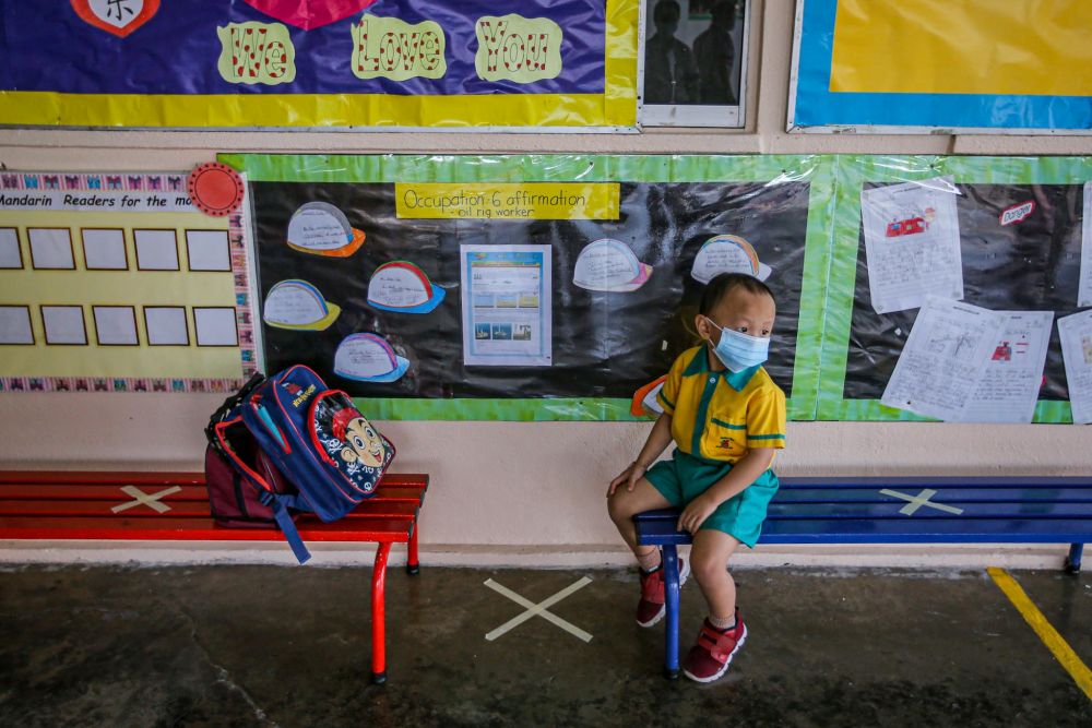 A preschooler is pictured at Mayter Kindergarten on his first day back at school in Cheras July 1, 2020. — Picture by Hari Anggara