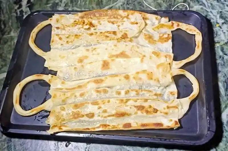 Temple City in Madurai, India has gone viral thanks to their Mask Parottas dish. u00e2u20acu201d Picture by Twitter/GCheriyan