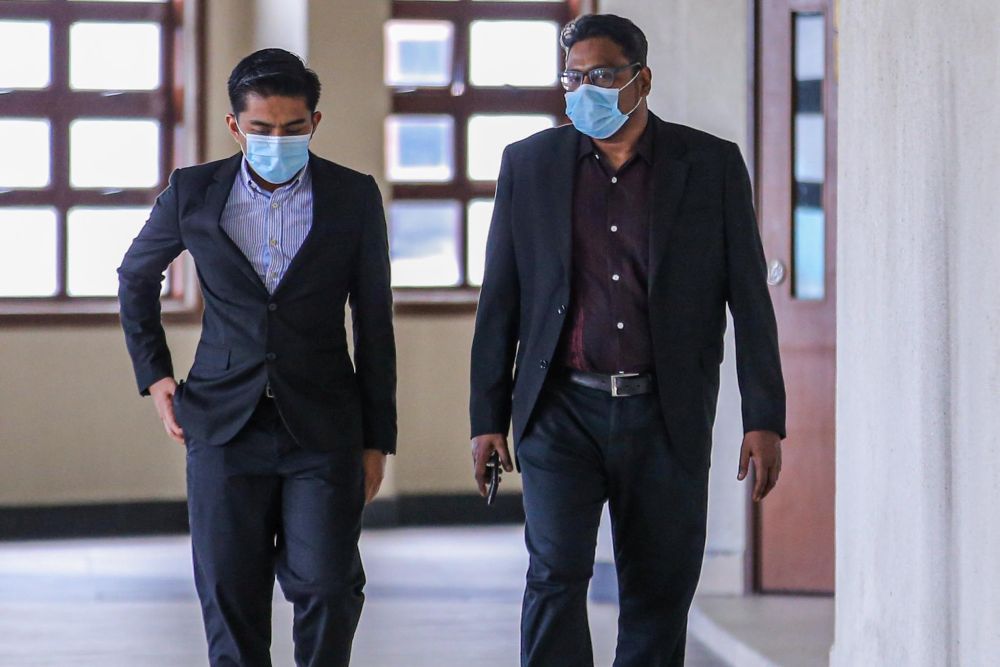 Jepak Holdings Sdn Bhd business partner Rayyan Radzwill Abdullah (right) is pictured at the Kuala Lumpur High Court on July 15, 2020. u00e2u20acu201d Picture by Hari Anggarann