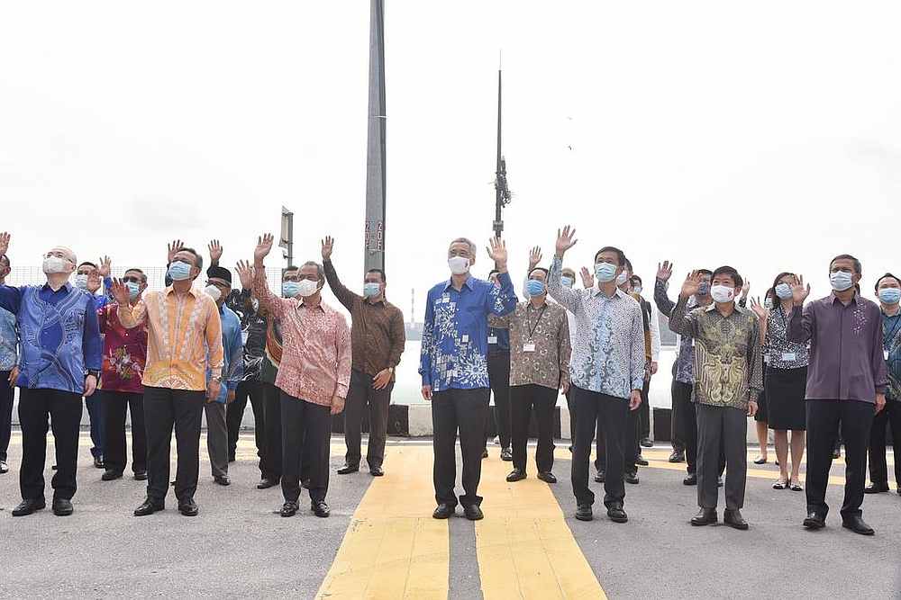 Government officials from Singapore and Malaysia at the Causeway on July 30, 2020, attending a signing ceremony to resume the Johor Bahru-Singapore Rapid Transit System project. u00e2u20acu201d TODAY pic