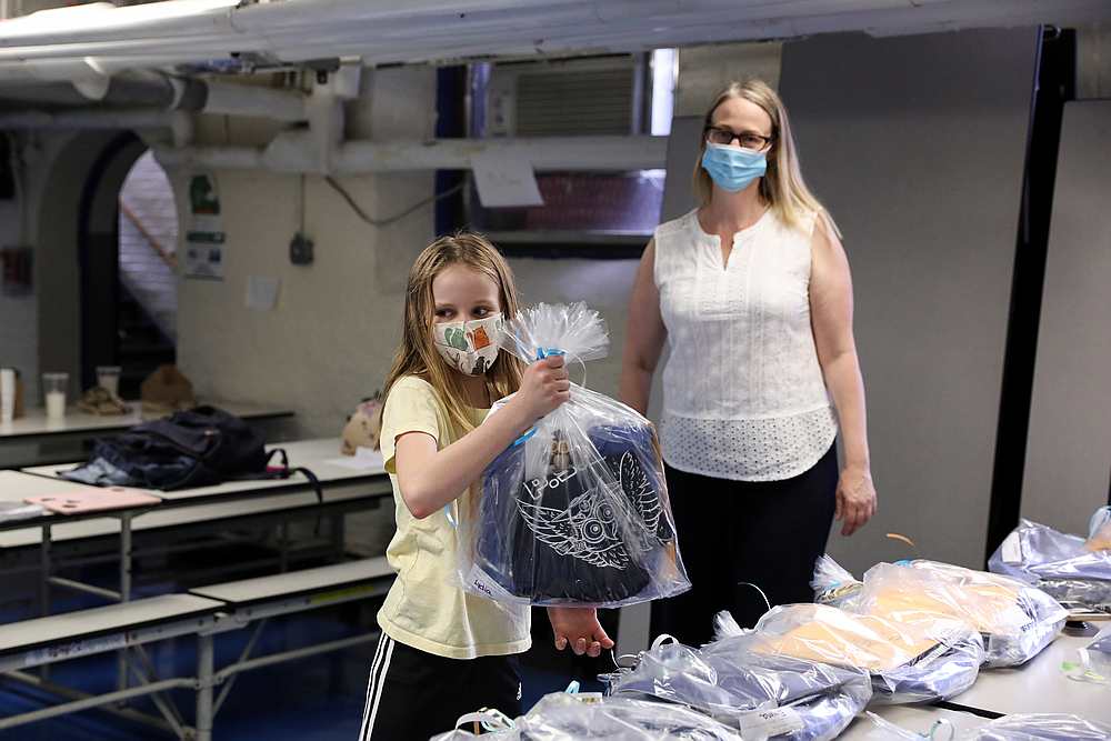 Lydia Hassebroek carries her bagged cap, gown, yearbook, and other materials for the end of the school year during the outbreak of Covid-19 in New York June 11, 2020. u00e2u20acu201d Reuters pic