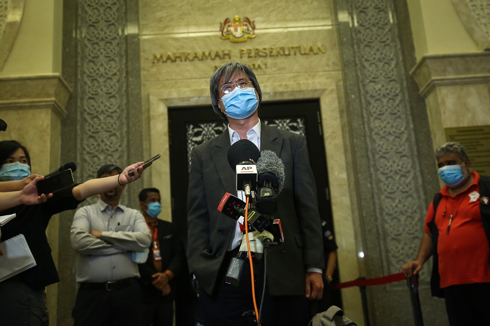 Malaysiakini editor-in-chief Steven Gan speaks to reporters outside the courtroom at the Federal Court in Putrajaya July 2, 2020. u00e2u20acu2022 Picture by Yusof Mat Isa
