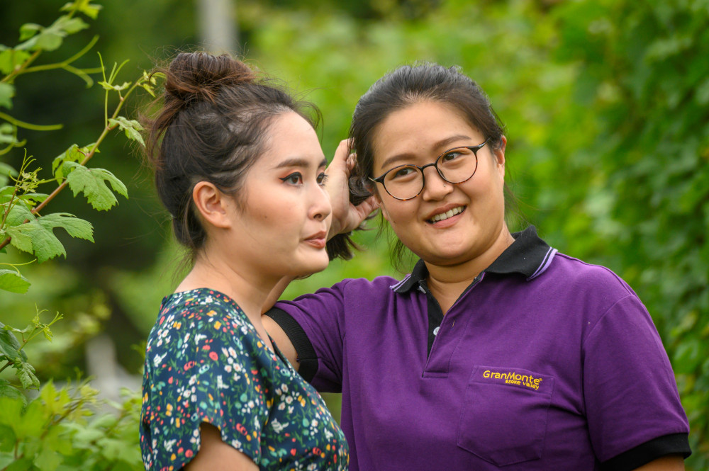 This photograph taken June 26, 2020 shows Mimi (left) and Nikki Lohitnavy at their GranMonte Vineyard and Winery in Nakhon Ratchasima. — AFP pic 