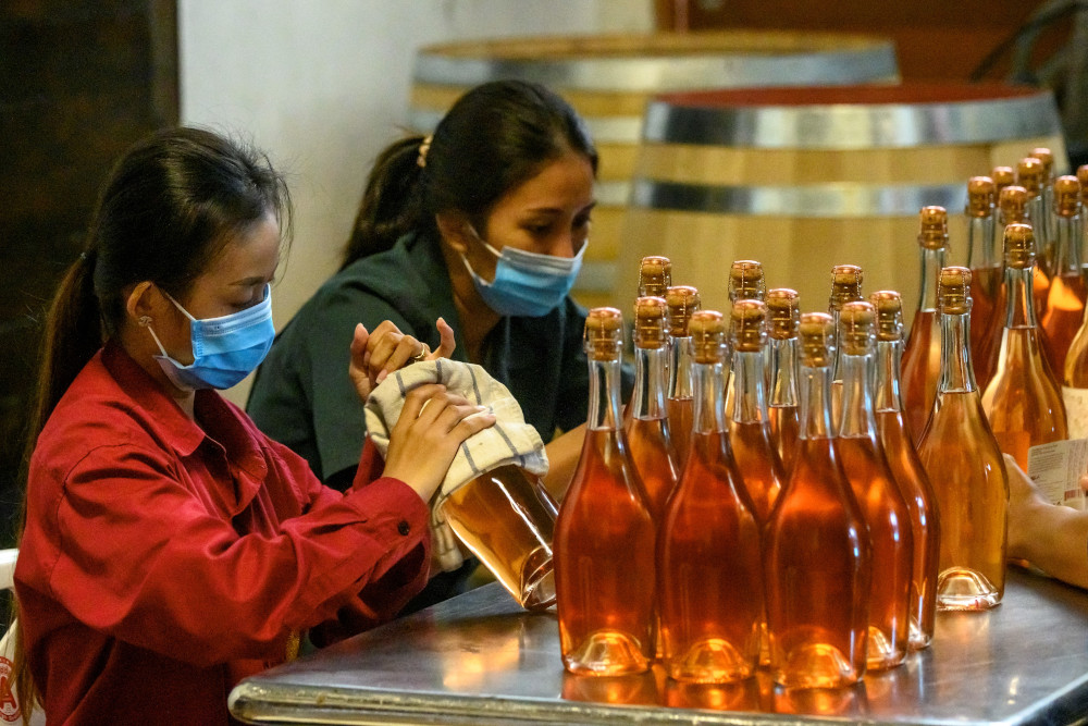Employees preparing sparkling wine for export at GranMonte Vineyard and Winery. — AFP pic 