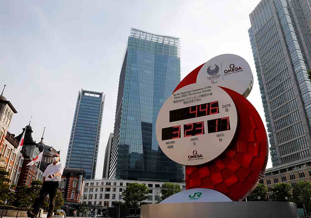 A man wearing a protective mask walks past a countdown clock for the Tokyo 2020 Olympic Games amid the Covid-19 outbreak in Tokyo, Japan June 4, 2020. u00e2u20acu201d Reuters pic