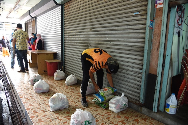 Essential groceries are ready to be distributed for those in need. — Picture courtesy of Facebook/ Kuan Chee Heng 