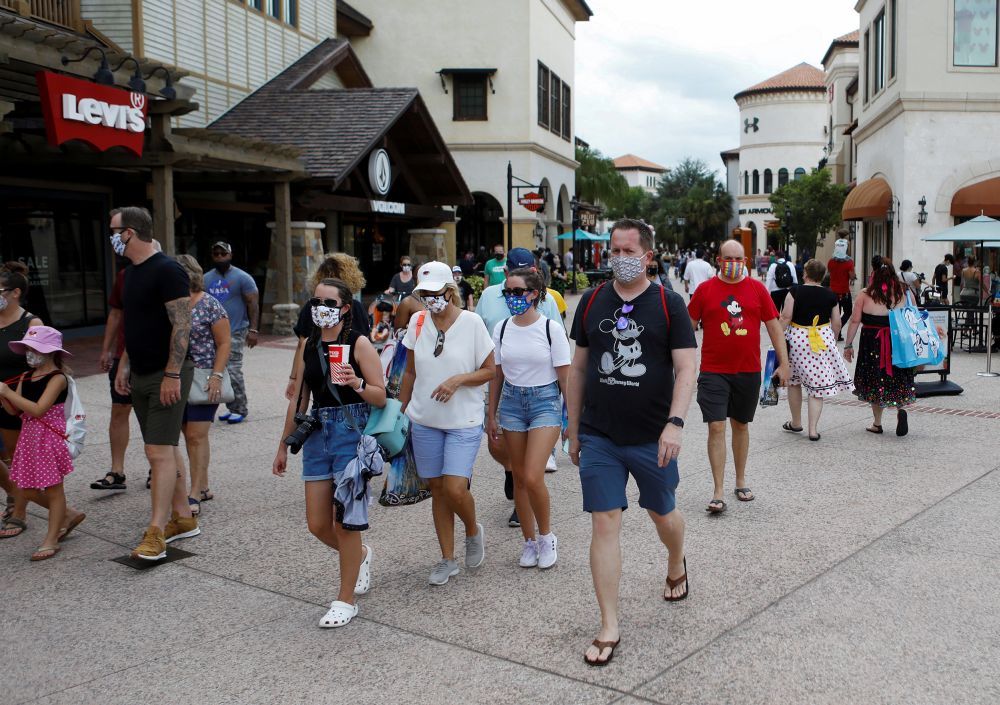 Disney Springs shoppers wear face masks and Disney-themed clothing while Walt Disney World conducts a phased reopening in Lake Buena Vista, Florida July 11, 2020. u00e2u20acu201d Reuters pic