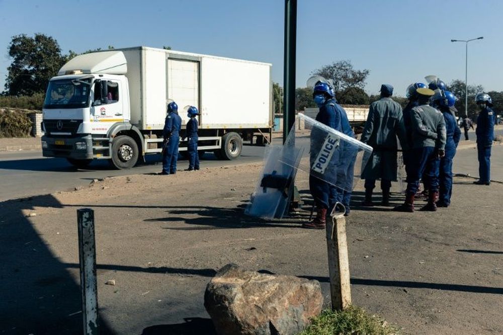 Police ask for travel documents at a road block in Mbare, a township in the suburbs of Harare. u00e2u20acu201d AFP pic