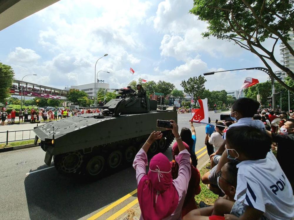 Crowds gather near Ng Teng Fong General Hospital to watch the mobile column on August 9, 2020. u00e2u20acu201d TODAY pic