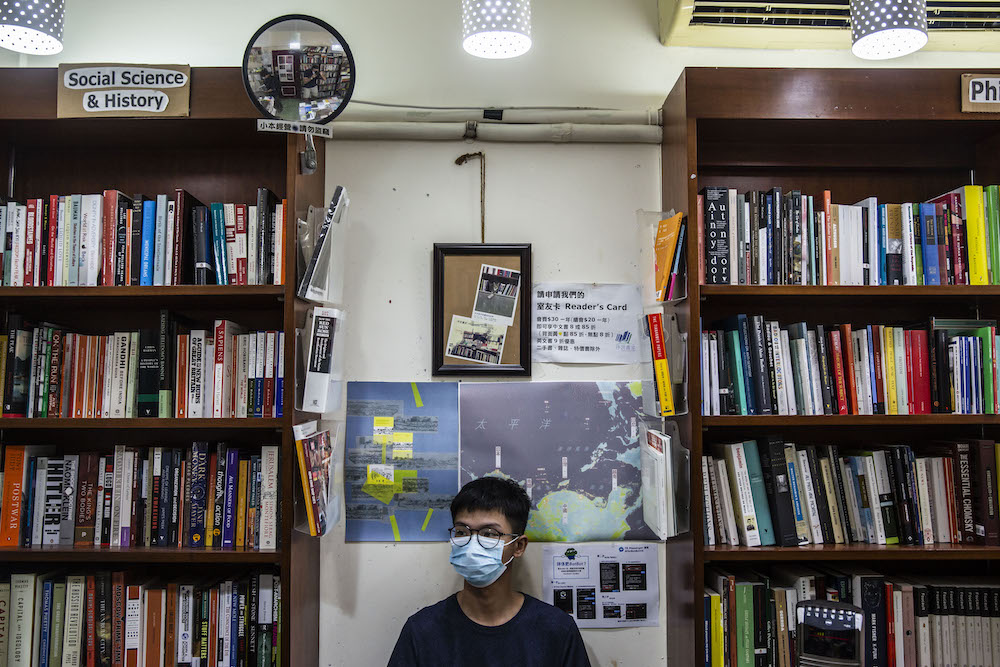 This picture taken on August 8, 2020 shows teenager Tony Chung sitting in a bookstore that is known for stocking books with sensitive political titles in Hong Kong. u00e2u20acu201d AFP pic