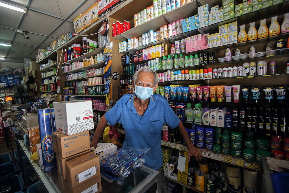 Chew Ah Kow, a convenient shop owner, said that Barisan Nasional has the advantage of winning the by-election as PAS supporters will be casting their votes for the BN candidate. — Picture by Farhan Najib