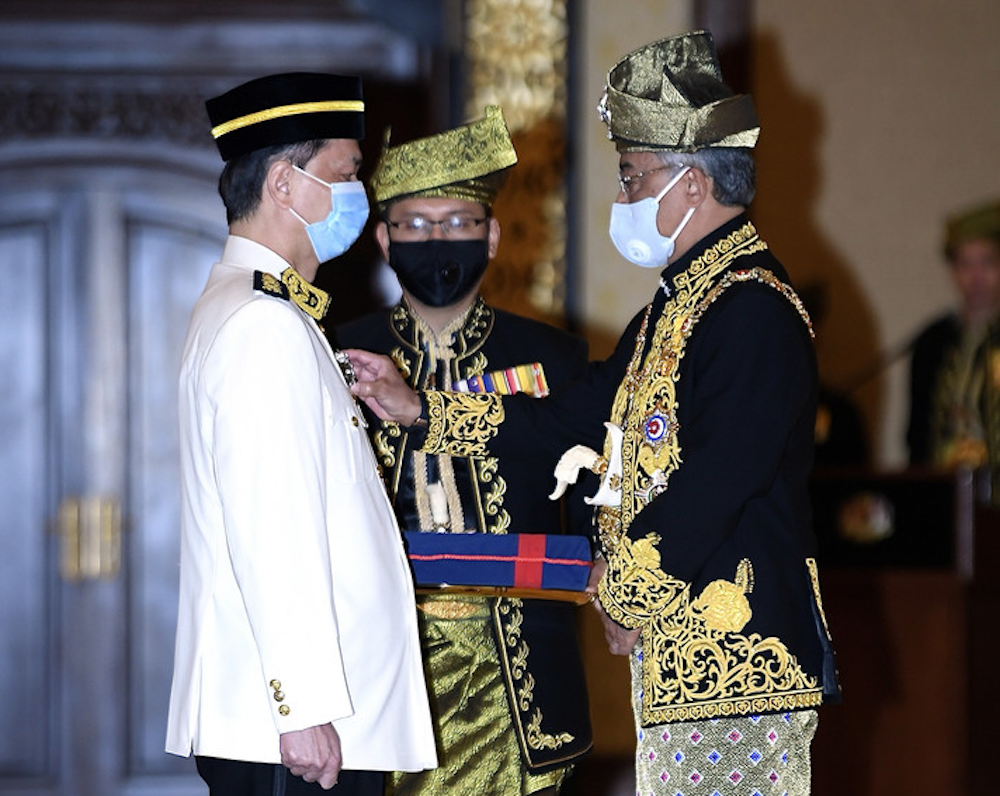 Yang di-Pertuan Agong Al-Sultan Abdullah Ri'ayatuddin Al-Mustafa Billah Shah (right) confers the Darjah Panglima Setia Mahkota (PSM) on Health director-general Tan Sri Dr Noor Hisham Abdullah at Istana Melawati August 17, 2020. u00e2u20acu201d Bernama pic