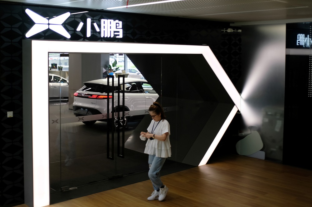 A woman walks by an Xpeng Motors showroom at its headquarters in Guangzhou China May 18, 2020. u00e2u20acu201d Reuters pic