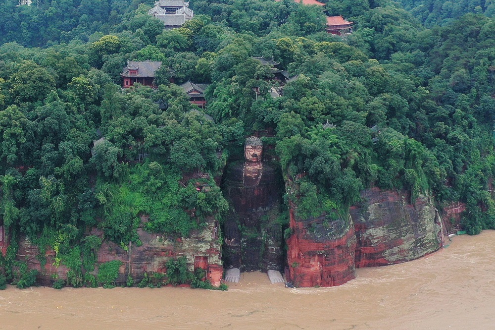 Floodwater reaches the Leshan Giant Buddhau00e2u20acu2122s feet following heavy rainfall, in Leshan, Sichuan province August 18, 2020. u00e2u20acu201d Picture by China Daily via Reutersnn