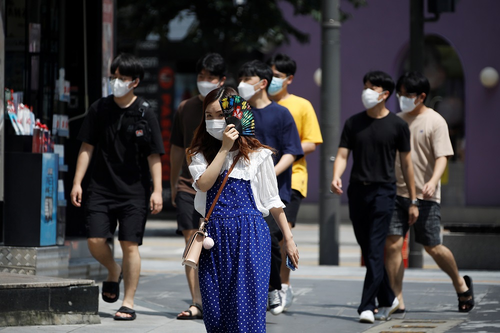 Pedestrians wearing masks to prevent the spread of the coronavirus disease walk in a shopping district in Seoul August 20, 2020. u00e2u20acu201d Reuters pic