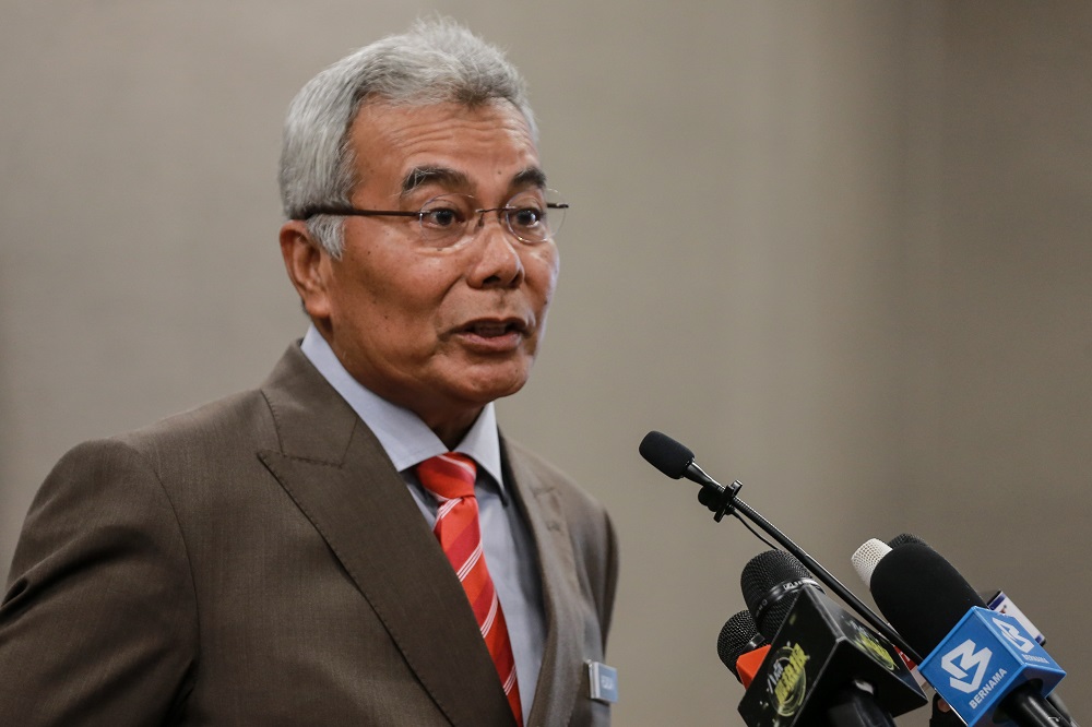 Minister in the Prime Ministeru00e2u20acu2122s Department Datuk Seri Mohd Redzuan Md Yusof speaks to reporters at the Parliament building August 10,2020. u00e2u20acu201d Picture by Ahmad Zamzahurinn