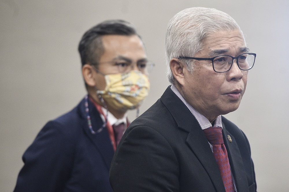 Pasir Gudang MP Hassan Abdul Karim (right) speaks during a press conference at Parliament in Kuala Lumpur August 11,2020. u00e2u20acu201d Picture by Miera Zulyana