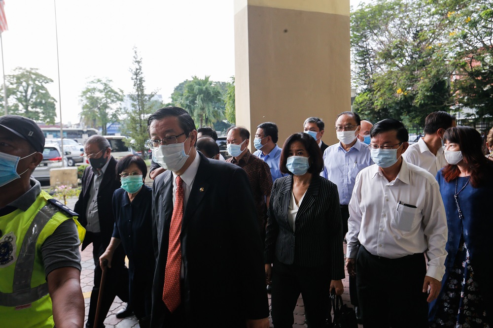 Former Penang chief minister Lim Guan Eng and his wife Betty Chew arrive at the Butterworth courthouse August 11, 2020. u00e2u20acu201d Picture by Sayuti Zainudin