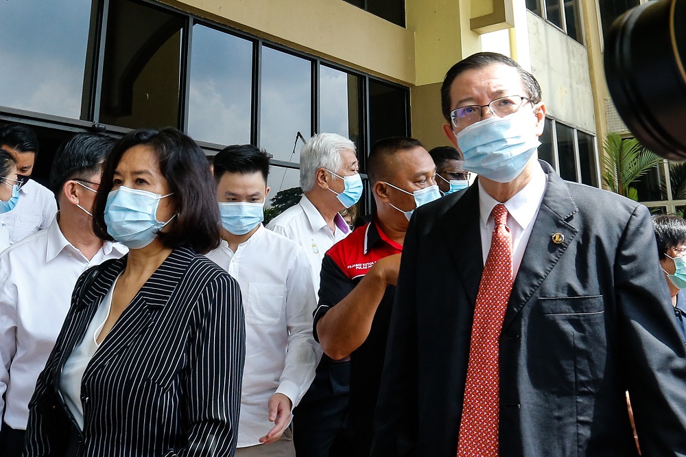 Former Penang chief minister Lim Guan Eng and his wife Betty Chew leaving the Butterworth courthouse August 11, 2020. u00e2u20acu201d Picture by Sayuti Zainudin