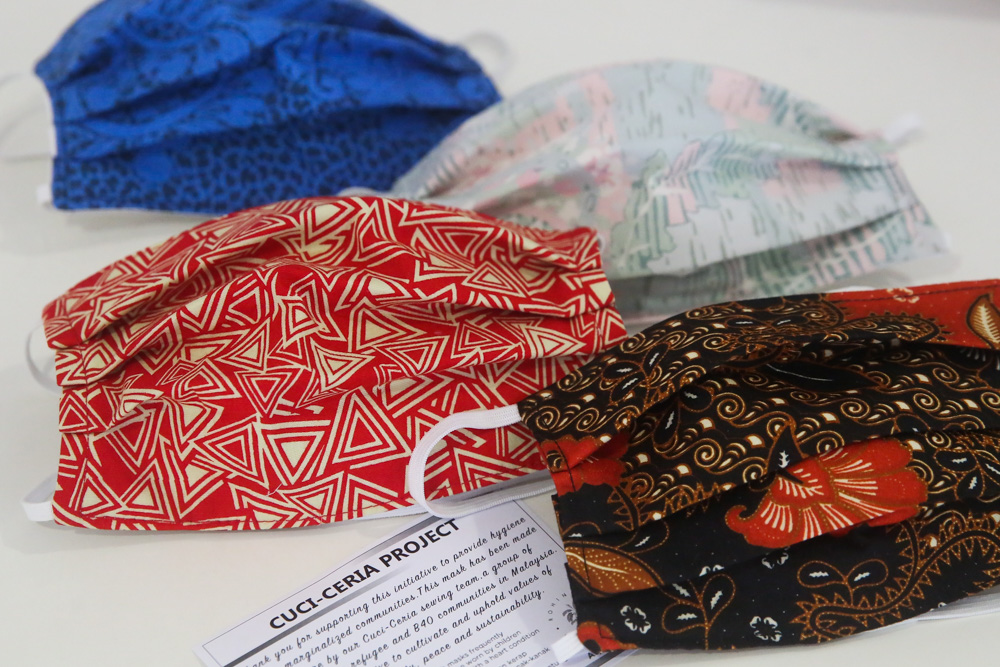 Handmade reusable face masks made by the refugees, B40 women come in different patterns and colours. — Picture by Choo Choy May. 
