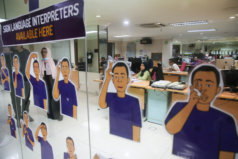 MFD’s office is designed to be a deaf-friendly space with glass walls that allow people to tell if someone is approaching and a blinking light that acts as a doorbell. — Picture by Choo Choy May