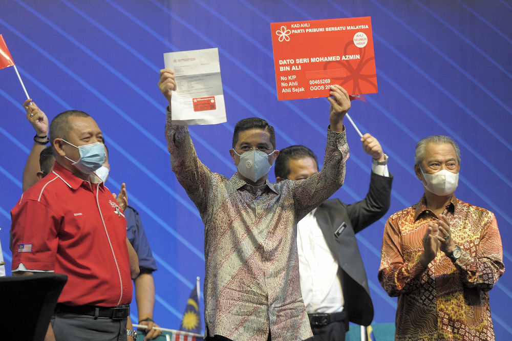 Datuk Seri Azmin Ali showing his Bersatu member card during the National Congress: Unite For Malaysia event at Malaysia International Trade & Exhibition Centre (MITEC) in Kuala Lumpur, August 22, 2020. u00e2u20acu201d Picture by Shafwan Zaidon
