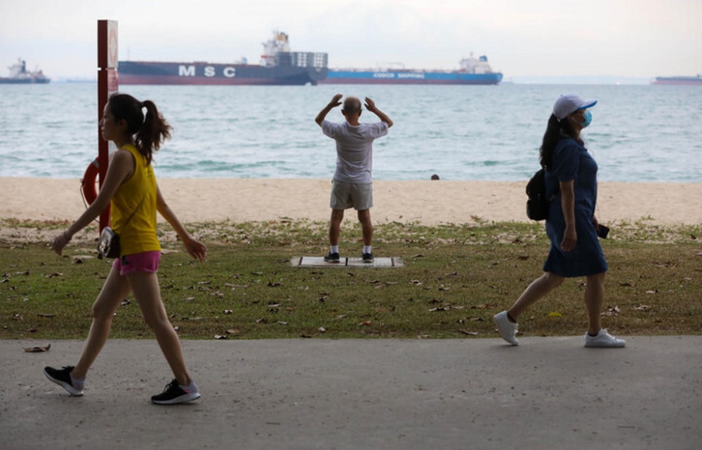 A man exercising at East Coast Park. Outdoor exercise classes must be organised by an instructor who will be responsible for ensuring that Covid-19 safe management measures are in place. u00e2u20acu201d TODAY pic