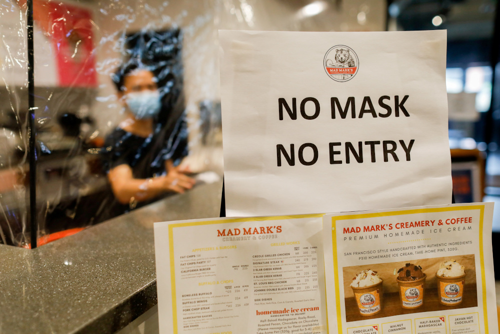 A u00e2u20acu02dcno mask, no entryu00e2u20acu2122 reminder for take-away customers and delivery riders is posted outside a restaurant to prevent the spread of the coronavirus disease in Quezon City, Metro Manila, Philippines, July 8, 2020. u00e2u20acu201d Reuters pic