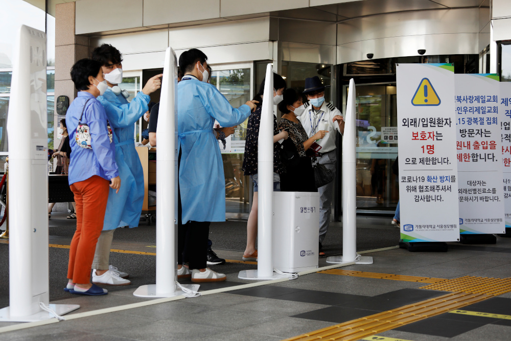 Visitors wearing masks to avoid the spread of the coronavirus disease fill out a form which is mandatory to get into a hospital in Seoul, South Korea, August 26, 2020. u00e2u20acu201d Reuters pic