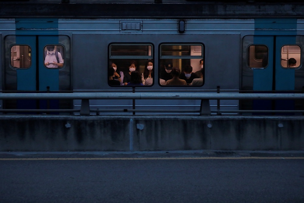 Commuters wearing masks ride a subway train amid the Covid-19 pandemic in Seoul August 25, 2020. u00e2u20acu2022 Reuters pic
