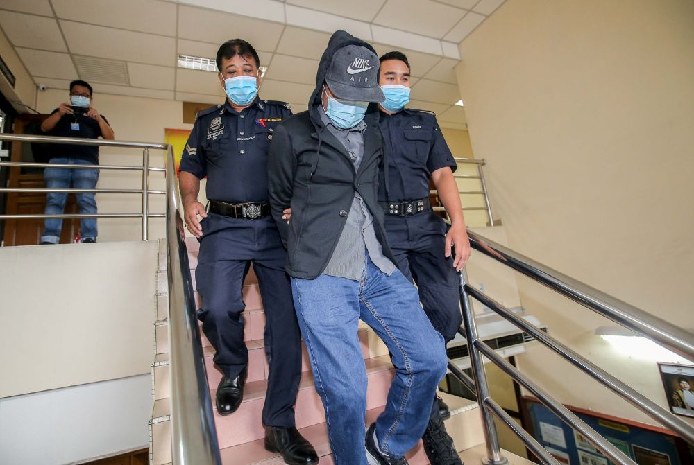 Former civil servant Herman Ibrahim is pictured at the Ipoh Sessions Court August 13, 2020. u00e2u20acu201d Picture by Farhan Najibn