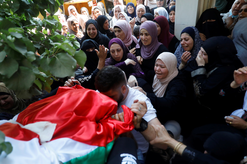 Relatives mourn near the body of Palestinian woman Dalia Smoudi, 23, during her funeral in Jenin in the Israeli-occupied West Bank August 7, 2020. u00e2u20acu201d Reuters pic 