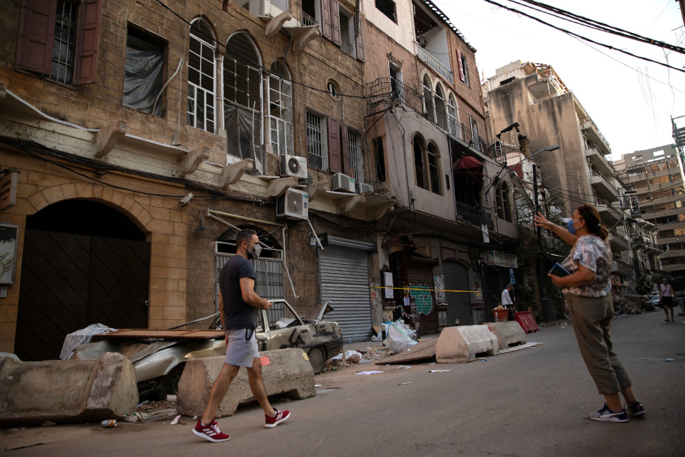 A woman points at damaged traditional Lebanese houses, following a massive explosion at the port area, in Beirut, Lebanon, August 14, 2020. u00e2u20acu201d Reuters pic 